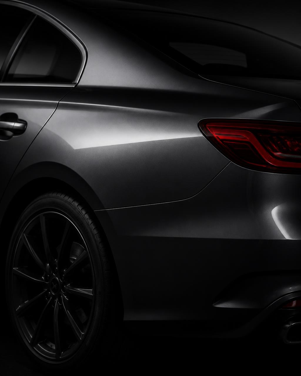 Rear quarter panel of a repaired sedan with a precise factory panel gap