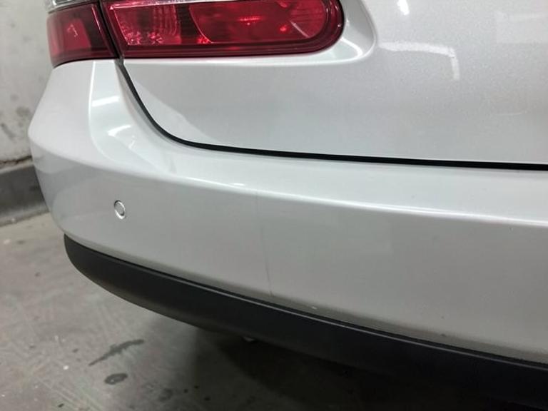 The same rear bumper repaired with an even factory panel gap